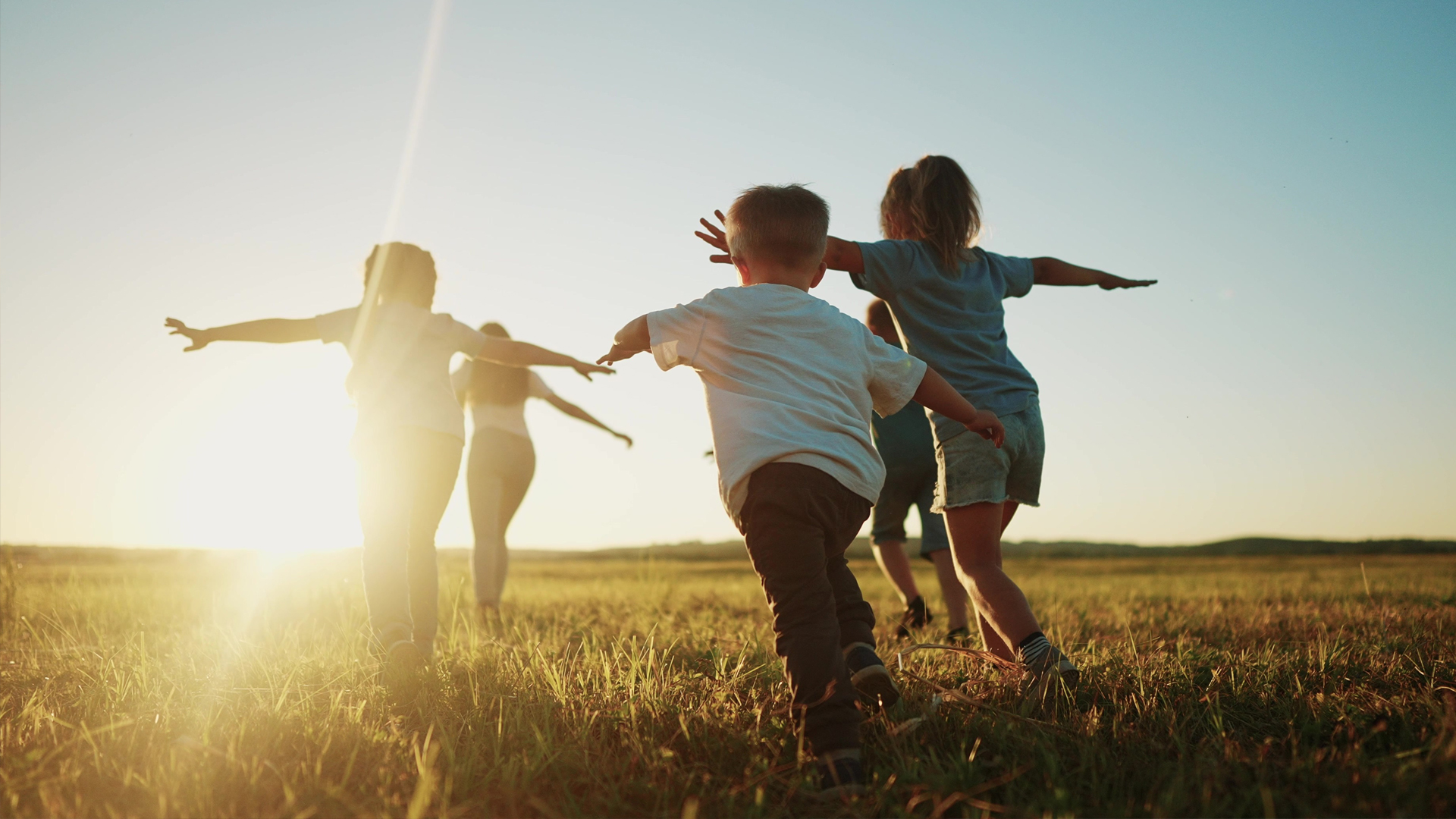 kids running with outstretched arms